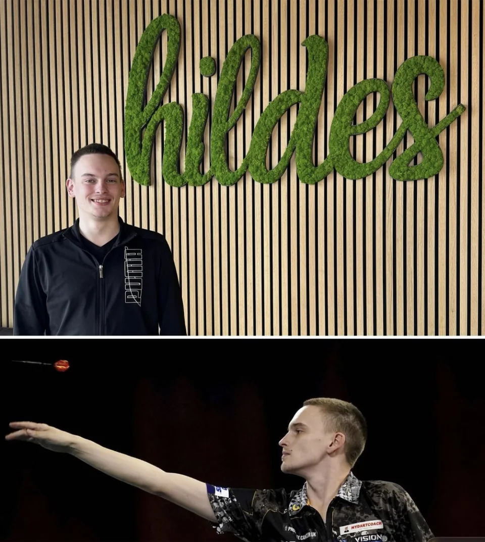 Sportlicher Gast und Dartmoment im hildes